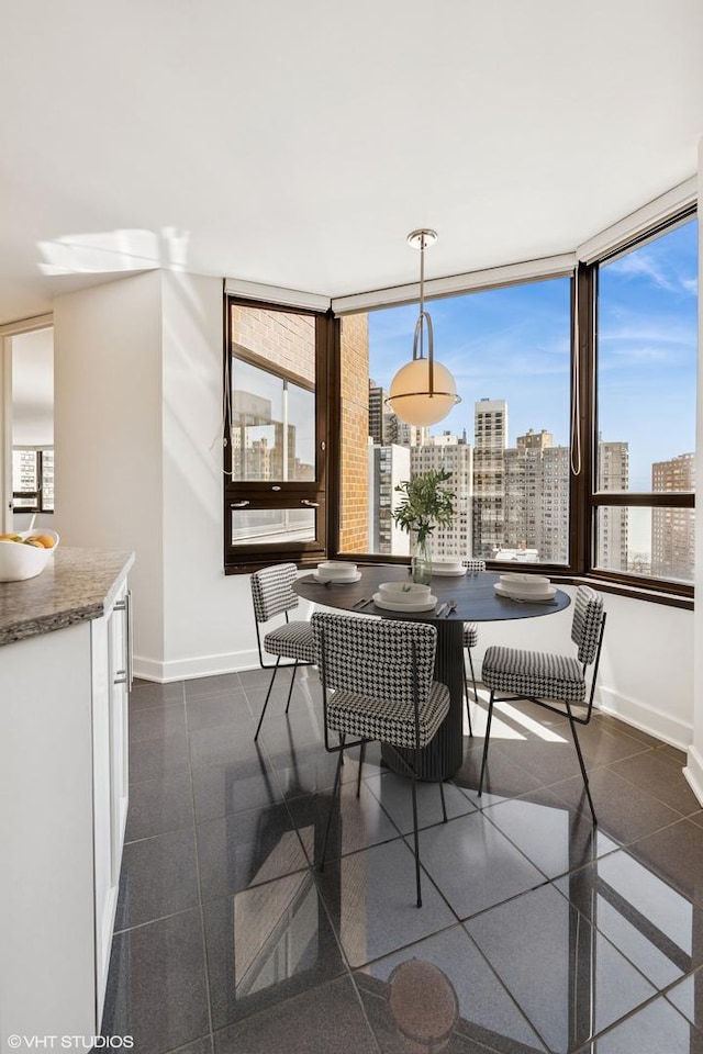1410 N State Pkwy Unit 17B, Chicago, IL 60610 - dining room with a view of city and granite tiled floors
