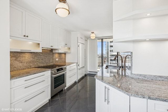 1410 N State Pkwy Unit 17B, Chicago, IL 60610 - kitchen featuring electric range, granite floors, backsplash, white cabinets, and under cabinet range hood