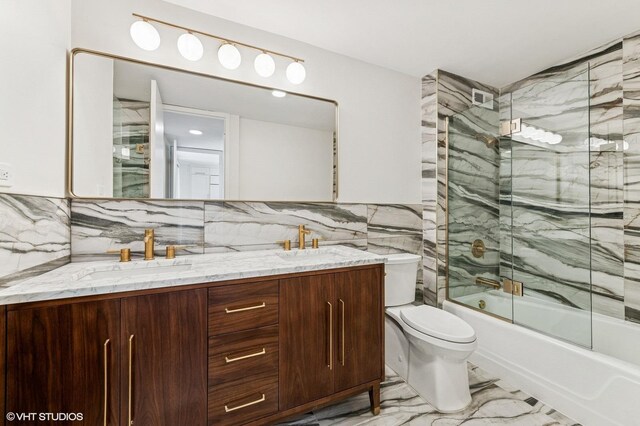 1410 N State Pkwy Unit 17B, Chicago, IL 60610 - bathroom featuring marble finish flooring, double vanity, tile walls, and shower / bath combination with glass door