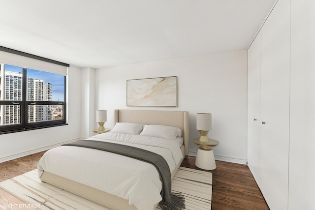 1410 N State Pkwy Unit 17B, Chicago, IL 60610 - bedroom with wood finished floors and a city view