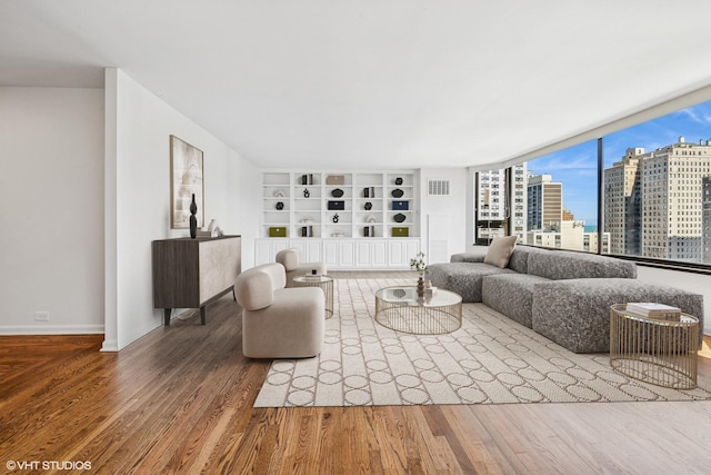1410 N State Pkwy Unit 17B, Chicago, IL 60610 - living area featuring wood finished floors, a view of city, and built in shelves