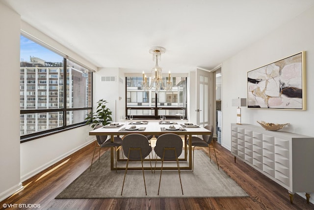 1410 N State Pkwy Unit 17B, Chicago, IL 60610 - dining space featuring a chandelier, healthy amount of natural light, and wood finished floors