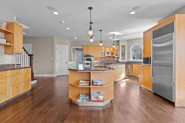 kitchen featuring light brown cabinets, open shelves, stainless steel appliances, and dark wood-style flooring