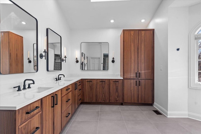 bathroom with recessed lighting, visible vents, a sink, and tile patterned flooring