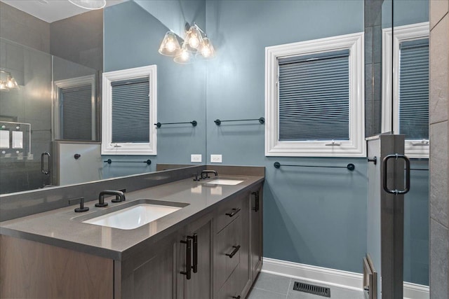 full bath with visible vents, a sink, tile patterned flooring, and double vanity