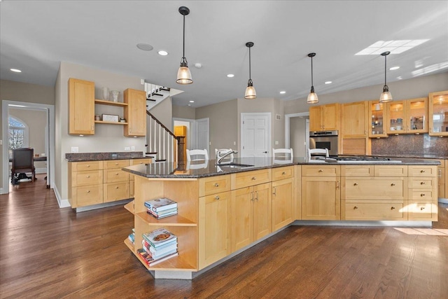 kitchen featuring open shelves, appliances with stainless steel finishes, and light brown cabinets