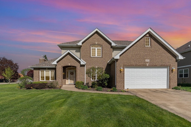 traditional home with a chimney, driveway, a front lawn, and brick siding
