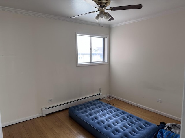 660 Washington Blvd Unit 5, Oak Park, IL 60302 - unfurnished bedroom featuring a baseboard heating unit, baseboards, wood finished floors, ornamental molding, and a ceiling fan