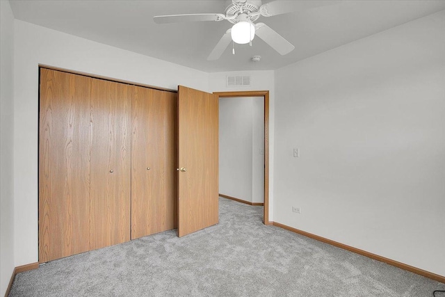 1123 Coneflower Ct, Minooka, IL 60447 - unfurnished bedroom featuring carpet flooring, a closet, baseboards, and a ceiling fan