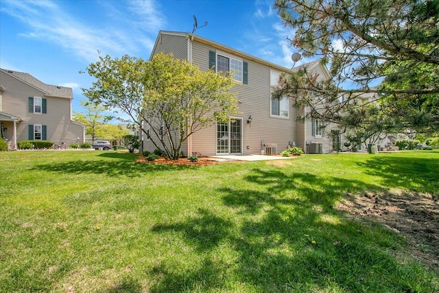 1123 Coneflower Ct, Minooka, IL 60447 - rear view of house featuring a yard, a patio, and central AC