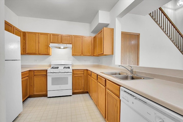 1123 Coneflower Ct, Minooka, IL 60447 - kitchen featuring white appliances, under cabinet range hood, a sink, light countertops, and brown cabinets