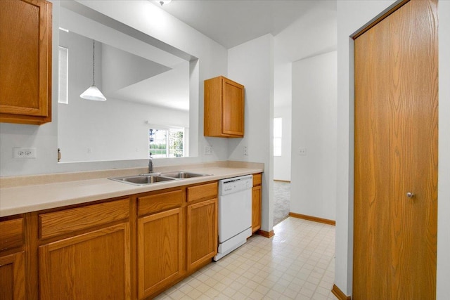 1123 Coneflower Ct, Minooka, IL 60447 - kitchen featuring dishwasher, a sink, light countertops, and brown cabinets