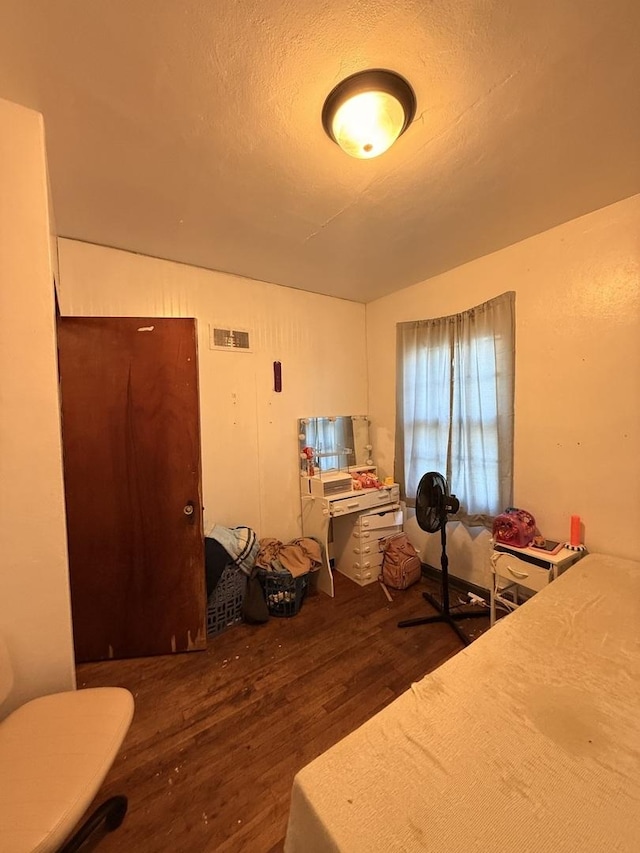 1004 Nowell Ave, Joliet, IL 60433 - bedroom with a textured ceiling, wood finished floors, and visible vents