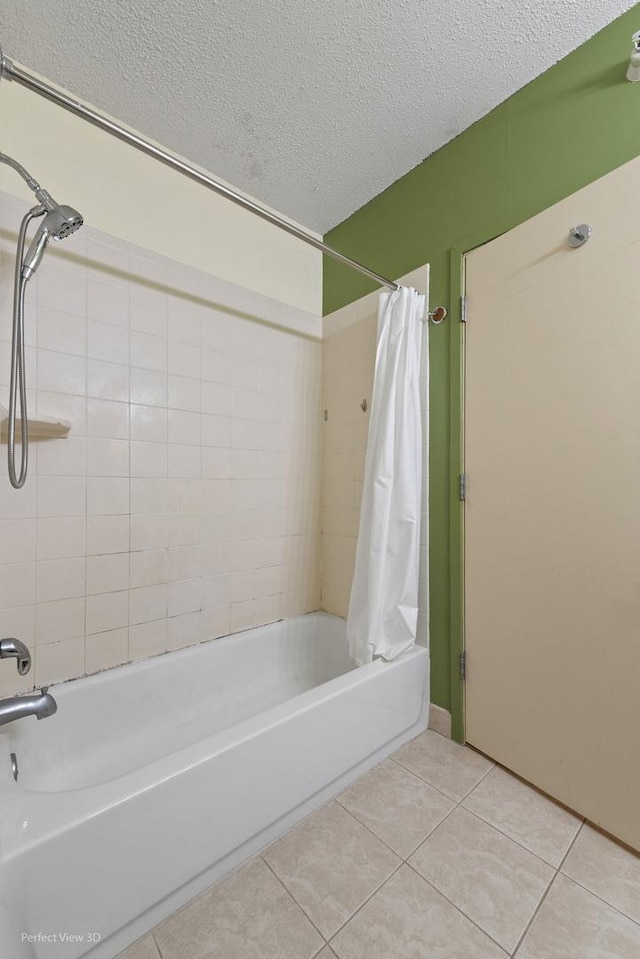 full bath with tile patterned floors, a textured ceiling, and shower / tub combo