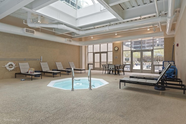 view of pool with french doors