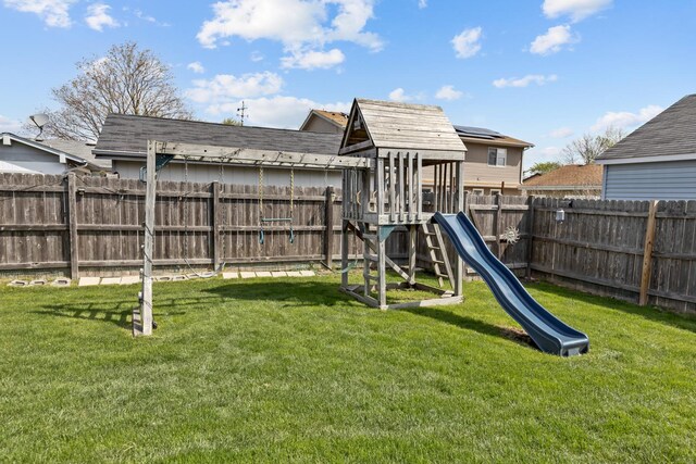 view of jungle gym with a fenced backyard and a yard