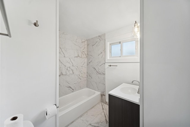 bathroom featuring vanity, washtub / shower combination, and marble finish floor