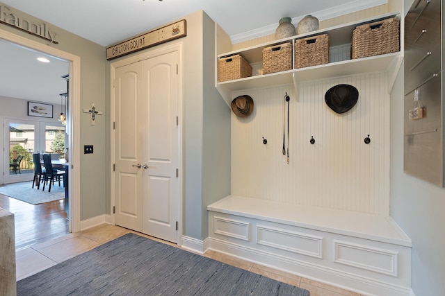 mudroom with baseboards, tile patterned flooring, and french doors