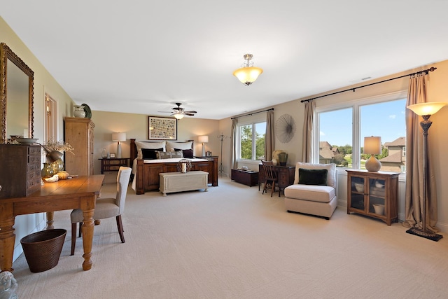 living room with light colored carpet and a ceiling fan