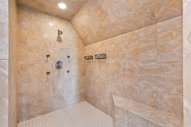 bathroom featuring a tile shower