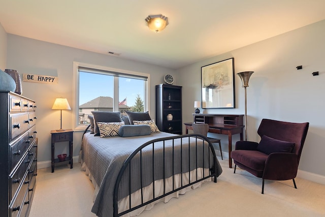 bedroom featuring visible vents, carpet flooring, and baseboards