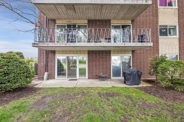 2900 Maple Ave Unit 5A, Downers Grove, IL 60515 - back of house featuring a balcony, a patio, and brick siding