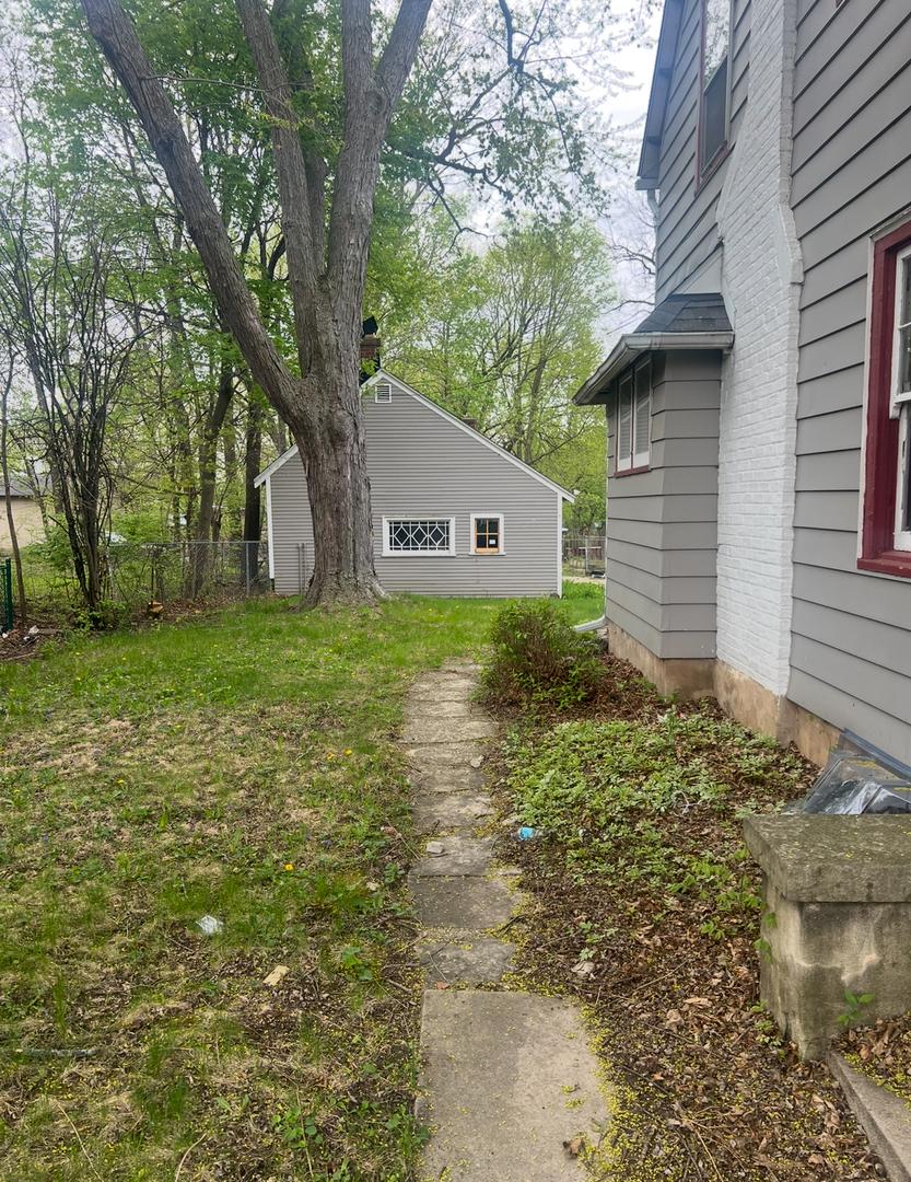 view of home's exterior featuring fence