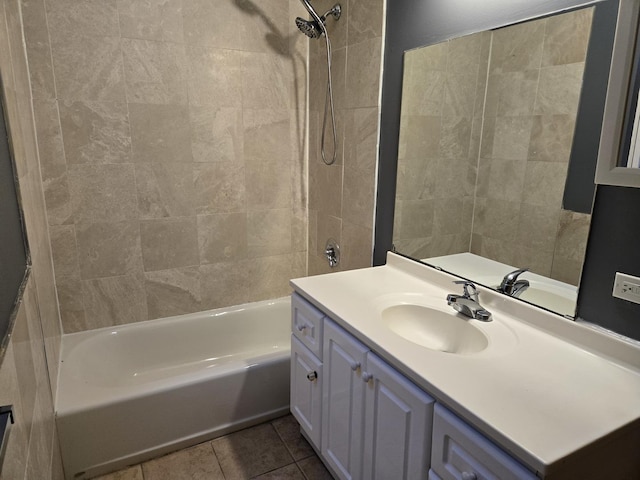 full bath featuring  shower combination, tile patterned flooring, and vanity