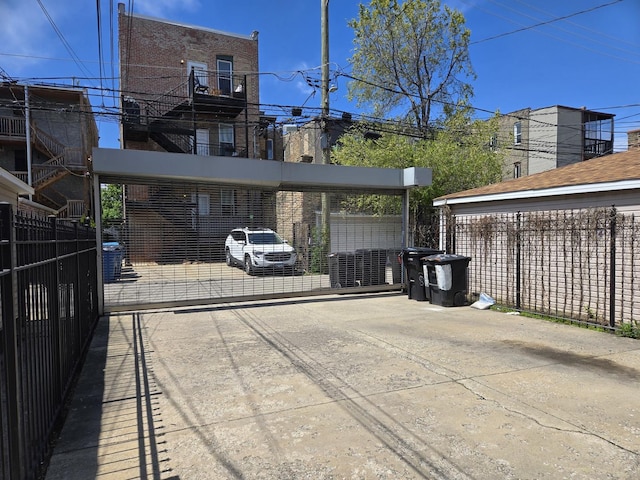view of patio with a gate and fence