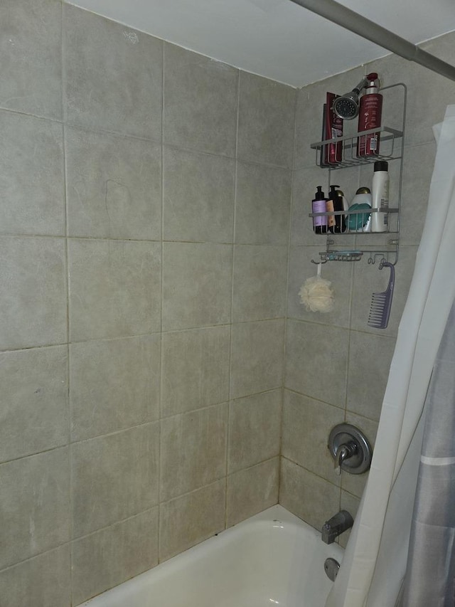 full bathroom with shower / bath combo