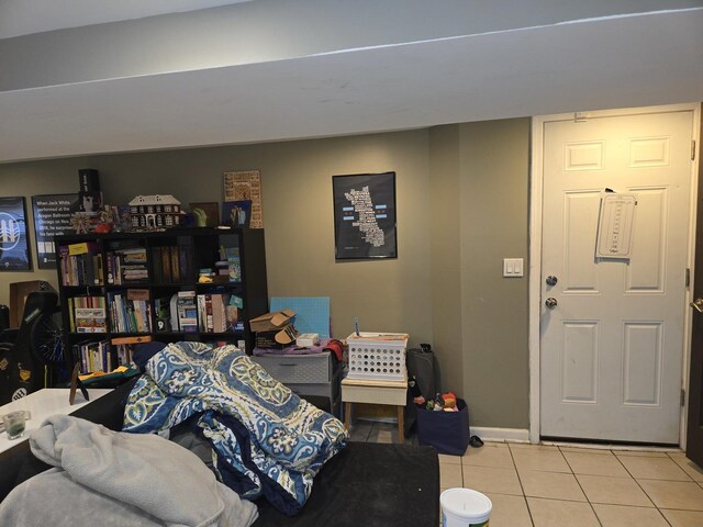 interior space with baseboards and tile patterned flooring