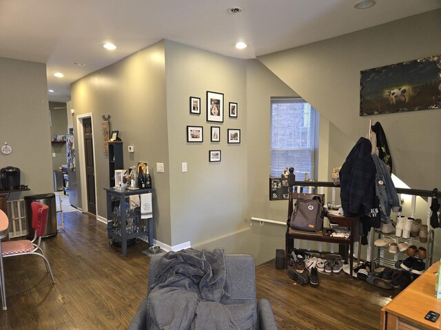 living room featuring recessed lighting, baseboards, and wood finished floors