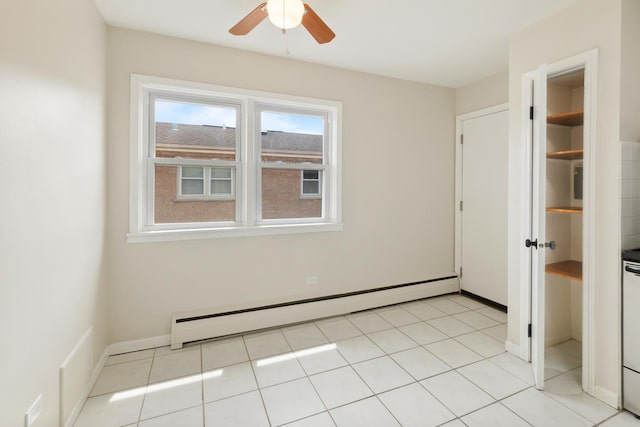 empty room with baseboards, ceiling fan, and baseboard heating