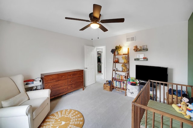 carpeted bedroom featuring visible vents and ceiling fan