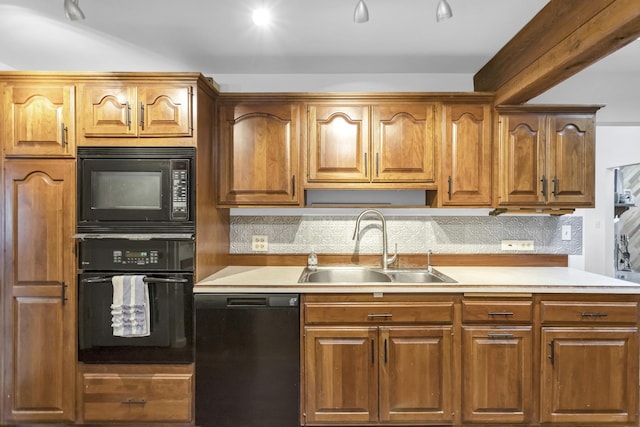 6029 Osage Ave, Downers Grove, IL 60516 - kitchen featuring black appliances, a sink, backsplash, and light countertops