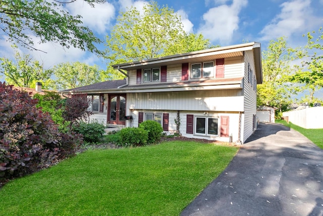 6029 Osage Ave, Downers Grove, IL 60516 - split level home with a front yard, an outbuilding, french doors, and a garage