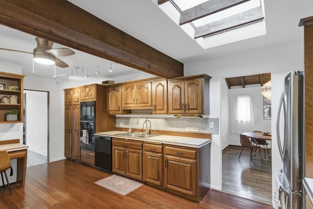 6029 Osage Ave, Downers Grove, IL 60516 - kitchen with a sink, black appliances, dark wood-type flooring, and ceiling fan