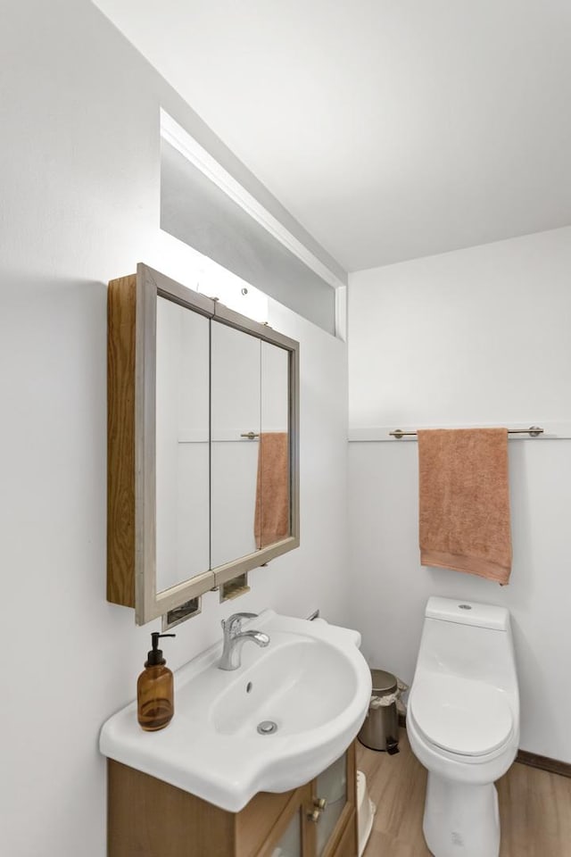 6029 Osage Ave, Downers Grove, IL 60516 - bathroom featuring vanity, wood finished floors, and toilet