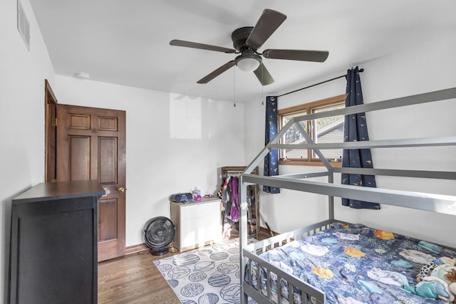 6029 Osage Ave, Downers Grove, IL 60516 - bedroom with wood finished floors, ceiling fan, and baseboards