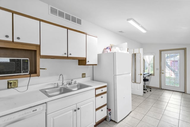 6029 Osage Ave, Downers Grove, IL 60516 - kitchen with a sink, white appliances, vaulted ceiling, white cabinetry, and light countertops