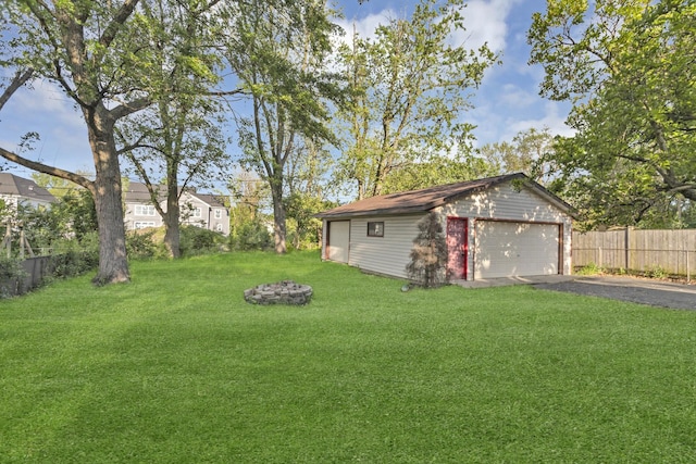 6029 Osage Ave, Downers Grove, IL 60516 - view of yard featuring a detached garage, an outbuilding, and a fire pit