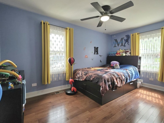 10847 Carpenter St, Mokena, IL 60448 - bedroom featuring visible vents, wood finished floors, and multiple windows