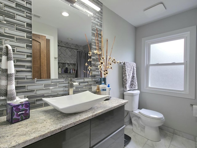10847 Carpenter St, Mokena, IL 60448 - full bath featuring visible vents, tasteful backsplash, vanity, toilet, and a shower with shower curtain