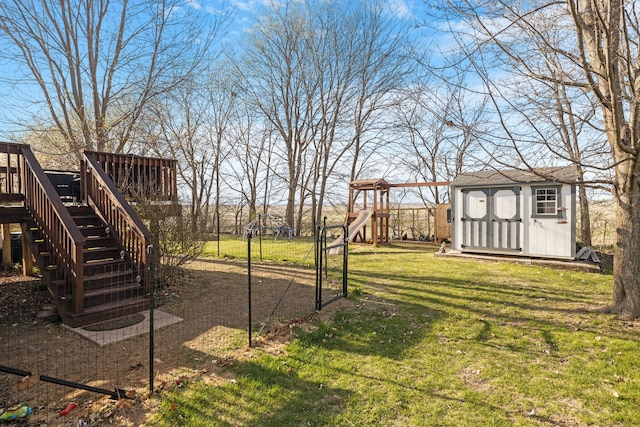 1352 Dahlgren Ln, Minooka, IL 60447 - view of yard with a wooden deck, a storage unit, stairs, a playground, and an outbuilding