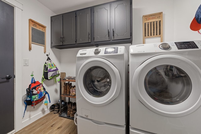 1352 Dahlgren Ln, Minooka, IL 60447 - washroom with light wood-type flooring, independent washer and dryer, and cabinet space
