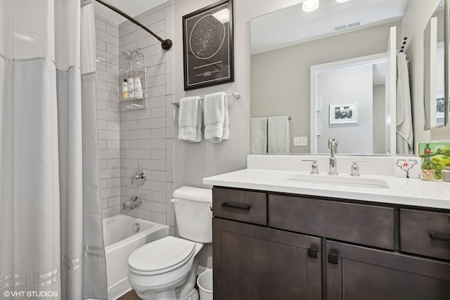bathroom with vanity, shower / bathtub combination with curtain, toilet, and visible vents