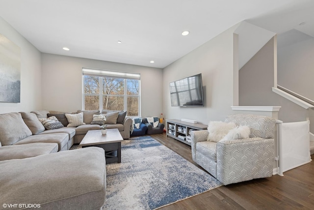 living area featuring recessed lighting and dark wood-type flooring