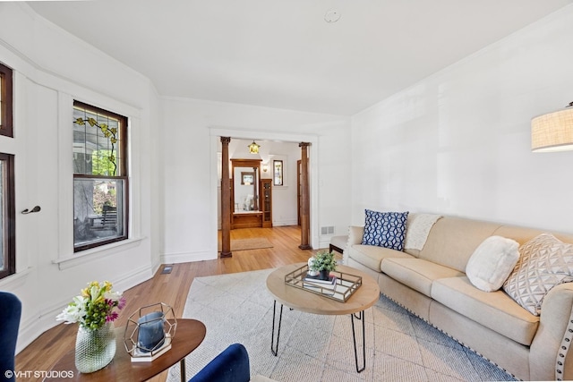 living area featuring light wood-style floors and baseboards