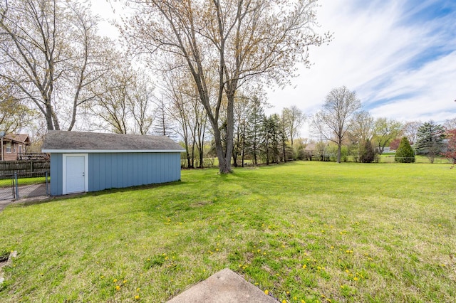 view of yard featuring an outdoor structure and fence