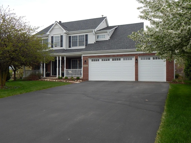 39W935 Berkshire Ct, Geneva, IL 60134 - traditional-style home with covered porch, driveway, a garage, brick siding, and a shingled roof